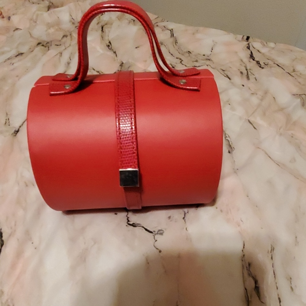 Avon Red Travel Bag with Structured Design and Polished Finish